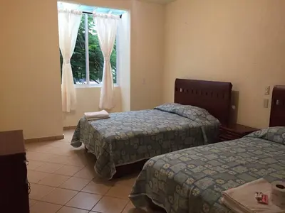 Cama o camas de una habitación en Hotel Tierra del Sol Oaxaca