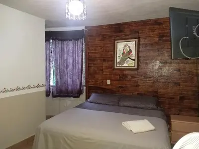 Cama o camas de una habitación en Hospedaje San Antonio Tepoztlán.