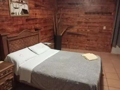 Cama o camas de una habitación en Hospedaje San Antonio Tepoztlán.
