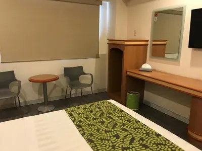 Cama o camas de una habitación en Hotel Aeropuerto