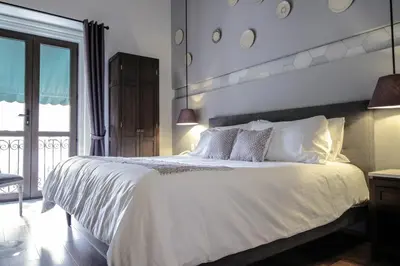 Cama o camas de una habitación en Casa Rosa Gran Hotel Boutique
