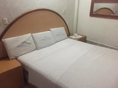 Cama o camas de una habitación en Hotel Paraiso Express