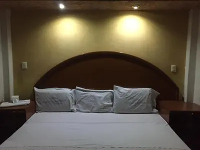 Cama o camas de una habitación en Hotel Paraiso Express