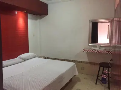 Cama o camas de una habitación en Hotel Paraiso Express