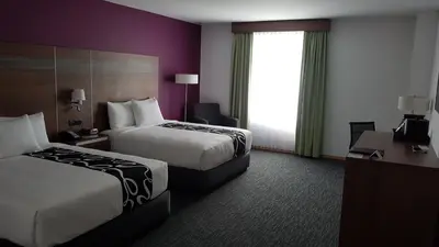 Cama o camas de una habitación en La Quinta by Wyndham San Jose Chiapa Puebla