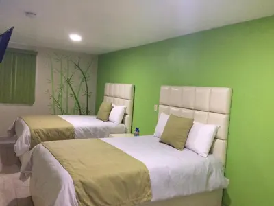 Cama o camas de una habitación en Andrea´s Hotel Boutique