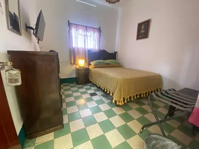 Cama o camas de una habitación en Hostal Mixteco Naba Nandoo