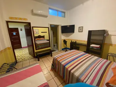 Cama o camas de una habitación en Hostal Mixteco Naba Nandoo