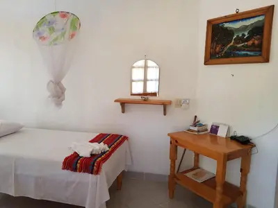 Cama o camas de una habitación en El Eden Bungalows