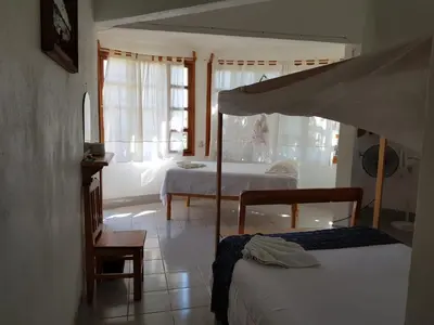 Cama o camas de una habitación en El Eden Bungalows