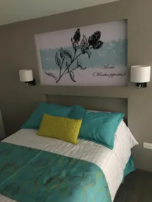 Cama o camas de una habitación en Herbal Inn Suites