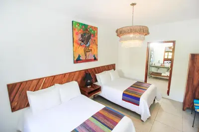 Cama o camas de una habitación en NaNa Vida Hotel Oaxaca