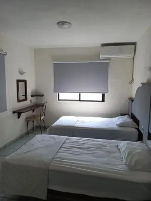 Cama o camas de una habitación en Invernadero Inn