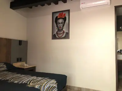 Cama o camas de una habitación en Hotel Frida