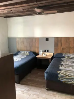 Cama o camas de una habitación en Hotel Frida