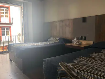 Cama o camas de una habitación en Hotel Frida