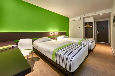 Cama o camas de una habitación en City Express Junior by Marriott Puebla Angelopolis