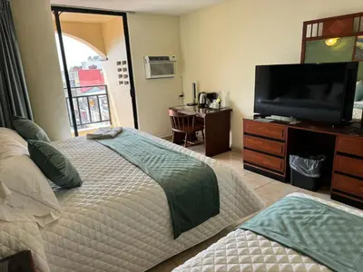 Una televisión o centro de entretenimiento en Hotel Bello Cordoba