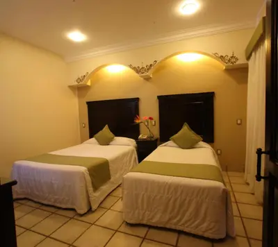 Cama o camas de una habitación en Hotel CasAntica
