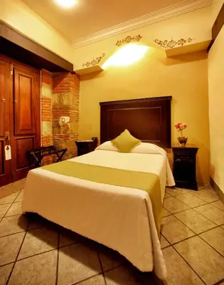 Cama o camas de una habitación en Hotel CasAntica