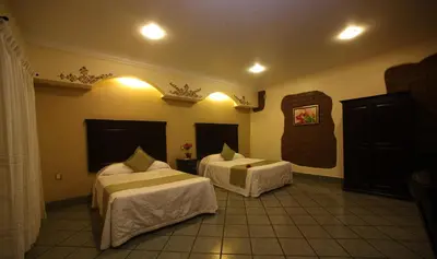 Cama o camas de una habitación en Hotel CasAntica