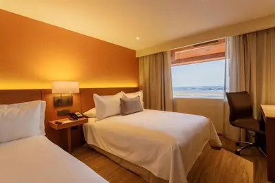 Cama o camas de una habitación en Camino Real Aeropuerto