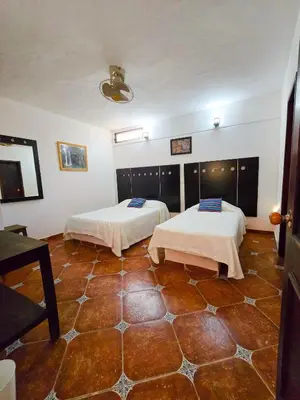 Cama o camas de una habitación en Hotel Villa Esmeralda