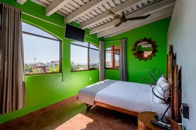 Cama o camas de una habitación en Suites La Hacienda