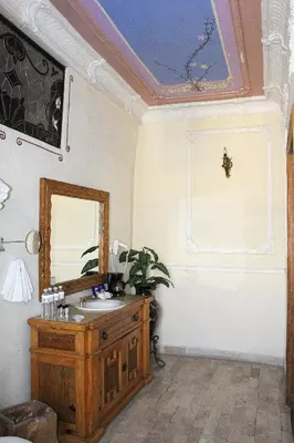Una televisión o centro de entretenimiento en Hotel Boutique Casa de la Palma