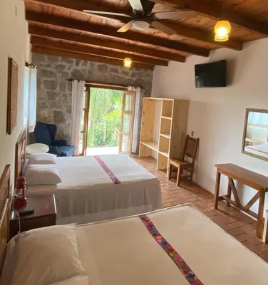Cama o camas de una habitación en Hotel Posada La Vereda