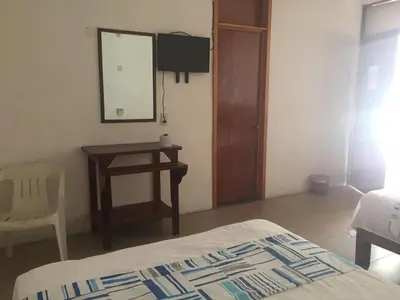 Cama o camas de una habitación en Hotel Carruiz