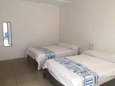 Cama o camas de una habitación en Hotel Carruiz