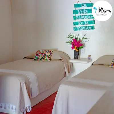 Cama o camas de una habitación en La Playita Beach House