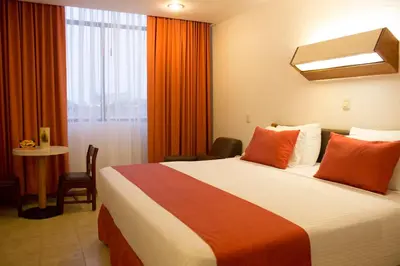 Cama o camas de una habitación en Hotel Enriquez