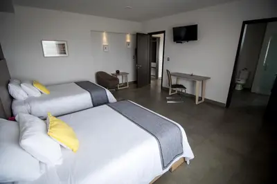 Cama o camas de una habitación en Maria Ines Hotel Suite