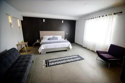 Cama o camas de una habitación en Maria Ines Hotel Suite