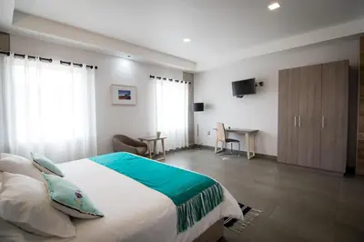 Cama o camas de una habitación en Maria Ines Hotel Suite