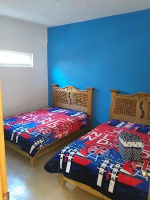 Cama o camas de una habitación en Hotel Villas Monteli Suites Cuernavaca