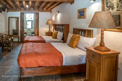 Cama o camas de una habitación en Hotel El Cristo