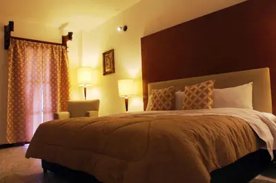 Cama o camas de una habitación en Hotel El Cristo