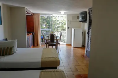 Cama o camas de una habitación en Alba Suites Acapulco