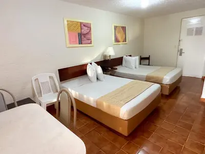 Cama o camas de una habitación en Alba Suites Acapulco