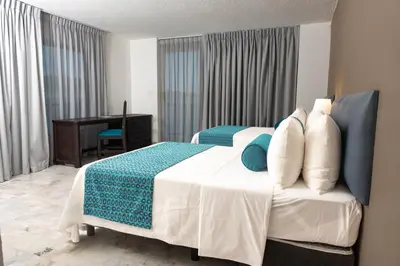 Cama o camas de una habitación en Ritz Acapulco All Inclusive