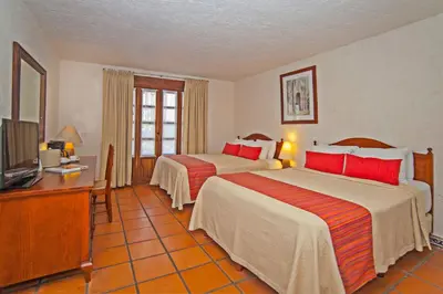Cama o camas de una habitación en Villa Blanca Huatulco