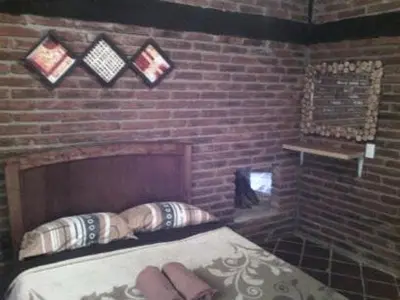 Cama o camas de una habitación en Cabanas Sierra Nublada