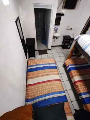 Cama o camas de una habitación en Hotelito Ejido