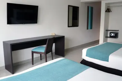 Cama o camas de una habitación en Hotel Rio 1300
