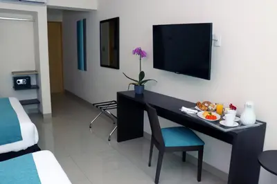 Una televisión o centro de entretenimiento en Hotel Rio 1300
