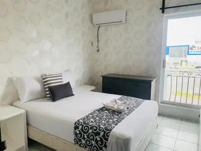 Cama o camas de una habitación en Hotel & Suites Bausan