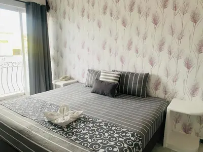 Cama o camas de una habitación en Hotel & Suites Bausan